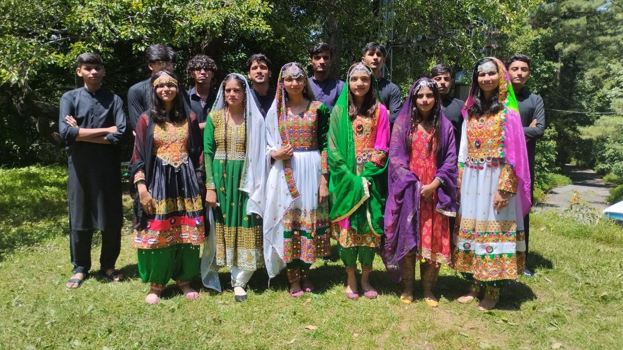 Camp counselors in traditional dress, 2023